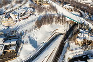 Snowy aerial view with a residential view