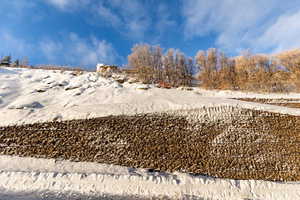View of yard layered in snow