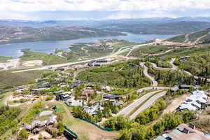 Aerial perspective of suburban area with a water and mountain view