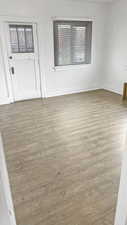 Spare room with light wood finished floors and baseboards