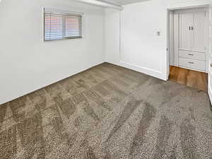 Unfurnished room with carpet flooring