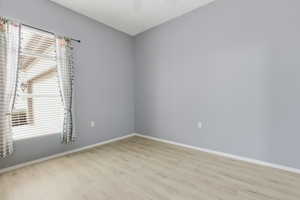Unfurnished room featuring light wood-style flooring