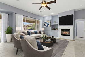 Living room featuring ceiling fan, a glass covered fireplace, light tile patterned flooring, and built in shelves