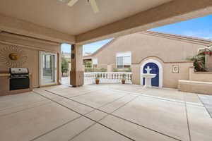 View of patio featuring a ceiling fan and grilling area