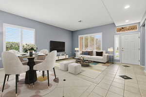 Living room with tile patterned floors and recessed lighting