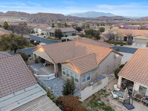Aerial view of residential area featuring a mountainous background