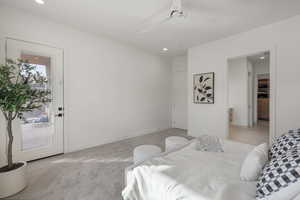 Carpeted bedroom featuring recessed lighting and ceiling fan