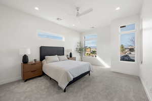 Bedroom featuring ceiling fan, light carpet, and recessed lighting