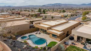 Aerial perspective of suburban area with a mountain backdrop
