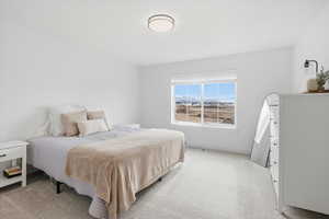 Carpeted bedroom with baseboards