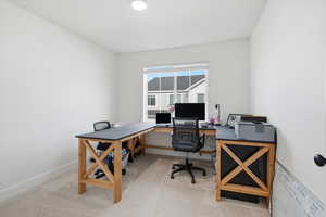 Office space featuring light carpet