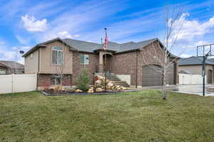View of front of property with a gate, an attached garage, brick siding, and a shingled roof