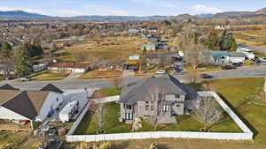 Aerial view of residential area featuring a mountainous background