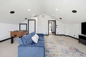 Living room featuring baseboards and light colored carpet