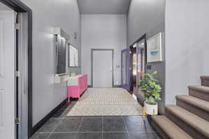 Corridor with a high ceiling and stairway