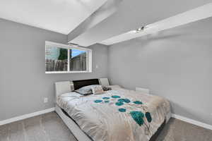 Bedroom with carpet and a textured ceiling