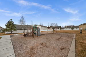 Community jungle gym with a residential view