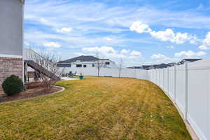 Fenced backyard with a patio