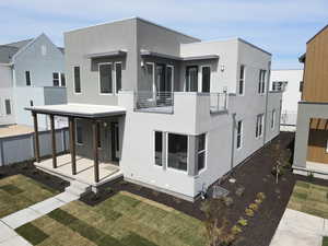 Contemporary home featuring covered porch and stucco siding