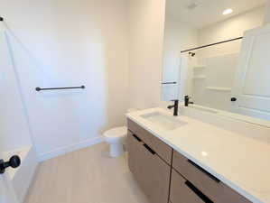 Upper Bathroom with vanity and recessed lighting