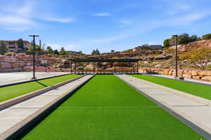 View of home's community featuring a bocce ball area