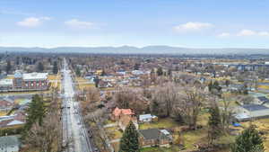 Aerial perspective of suburban area with a mountainous background