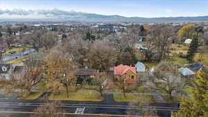 Aerial view of residential area featuring a mountainous background