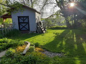 Fenced yard with a storage unit