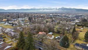 Aerial perspective of suburban area featuring a mountain backdrop