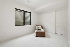 Living area with carpet floors and baseboards