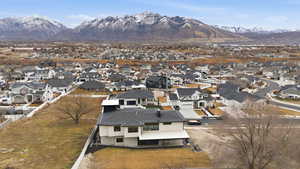 Aerial perspective of suburban area featuring mountains