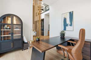 Home office with light wood finished floors