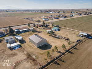 Aerial view of property and surrounding area with rural landscape and farmland