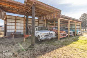 View of parking with a pole building
