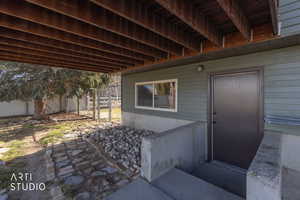 Entrance to property with a patio