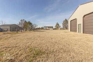 View of yard with an outbuilding and a detached garage