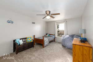 Bedroom featuring carpet and a ceiling fan