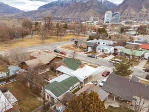 Aerial view of residential area with mountains and Provo River Trail park just one house away!