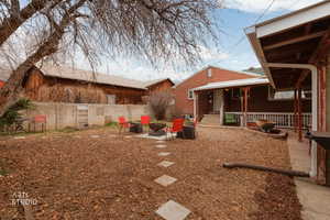 View of yard featuring a patio area and an outdoor fire pit