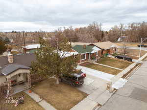 Aerial perspective of suburban area Provo River Trail and park. New concrete driveway and repaired drive approach.
