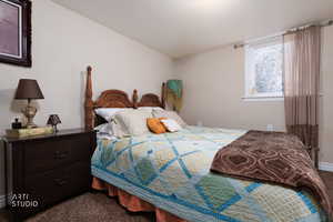Bedroom 2 with carpet flooring. Plenty of sunlight through large window.