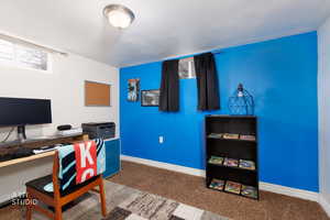 Home office with carpet flooring and baseboards, bonus room for use in whatever suits you best!