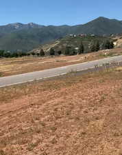 View of mountain backdrop with rural landscape
