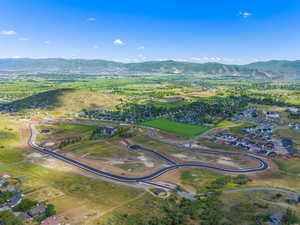 Aerial view of residential area featuring a mountainous background