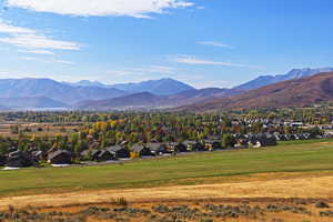 View of mountain backdrop featuring nearby suburban area