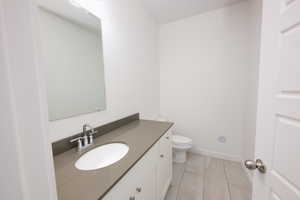 Bathroom featuring vanity and light tile patterned flooring