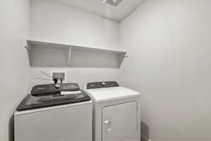 Laundry area featuring independent washer and dryer