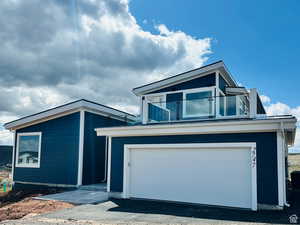 View of front of home featuring a garage