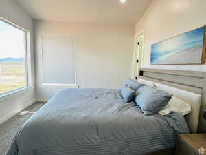 Bedroom with carpet floors and a mountain view