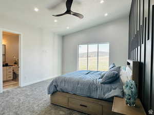 Carpeted bedroom featuring recessed lighting, ceiling fan, ensuite bathroom, lofted ceiling, and access to exterior